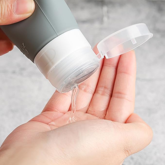 DEPOZA Travel Bottles Kit (16 Pack) - TSA Approved, Leak Proof Silicone Squeezable Containers for Toiletries. Complete Set with Jars, Sprayers & Bag (Black)