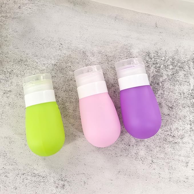 Mziart Travel Bottles for Toiletries, TSA Approved 2oz Silicone Travel Size Containers, 3 Pack Leak-Proof Squeezable Refillable Shampoo and Conditioner Bottles (Pink, Purple, Green)